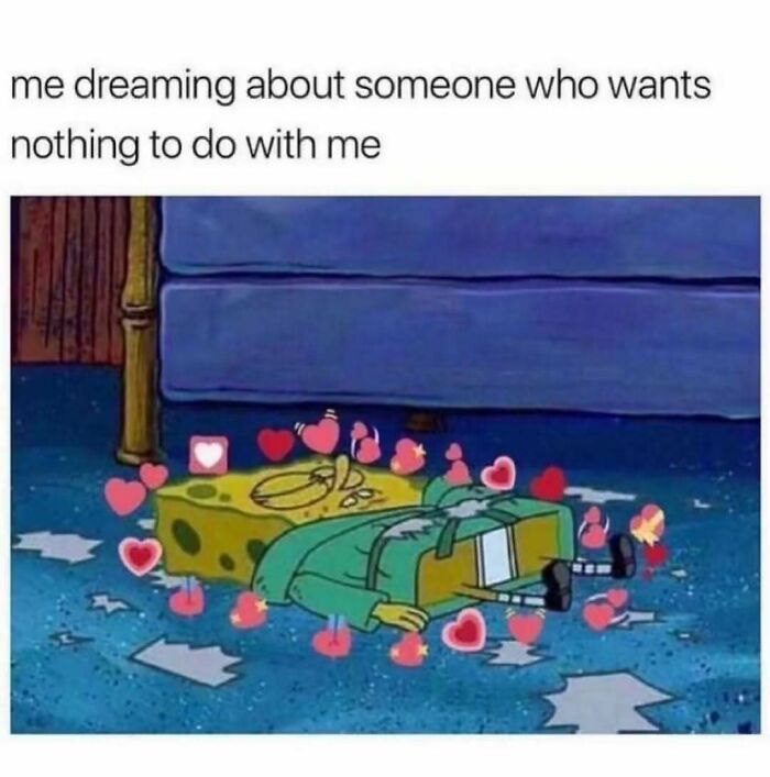 SpongeBob lying on the floor surrounded by heart emojis, representing relatable energy in funny meme culture.