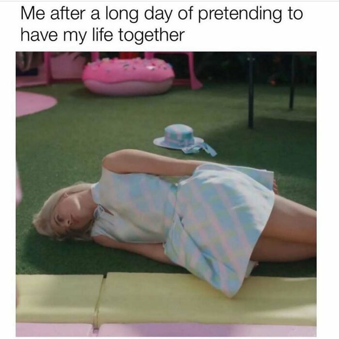 Person lying on grass looking exhausted with caption about pretending to have life together in relatable energy meme.