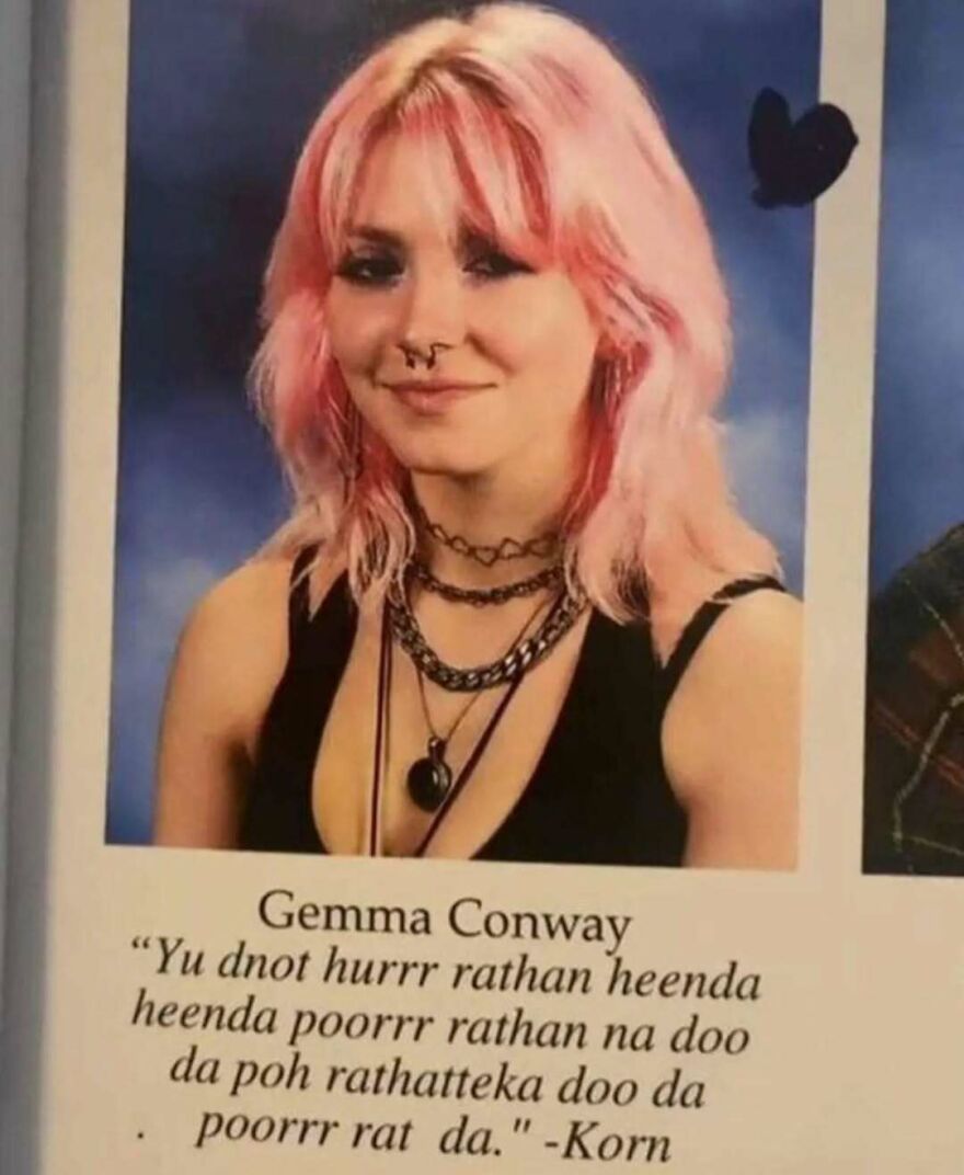 Young woman with pink hair and multiple necklaces posing for a bizarre yet hilarious pic that might make you do a double take