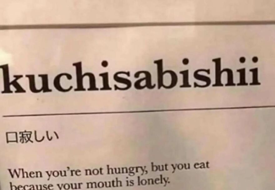 Close-up of a bizarre yet hilarious text explaining the Japanese word kuchisabishii about eating when not hungry.