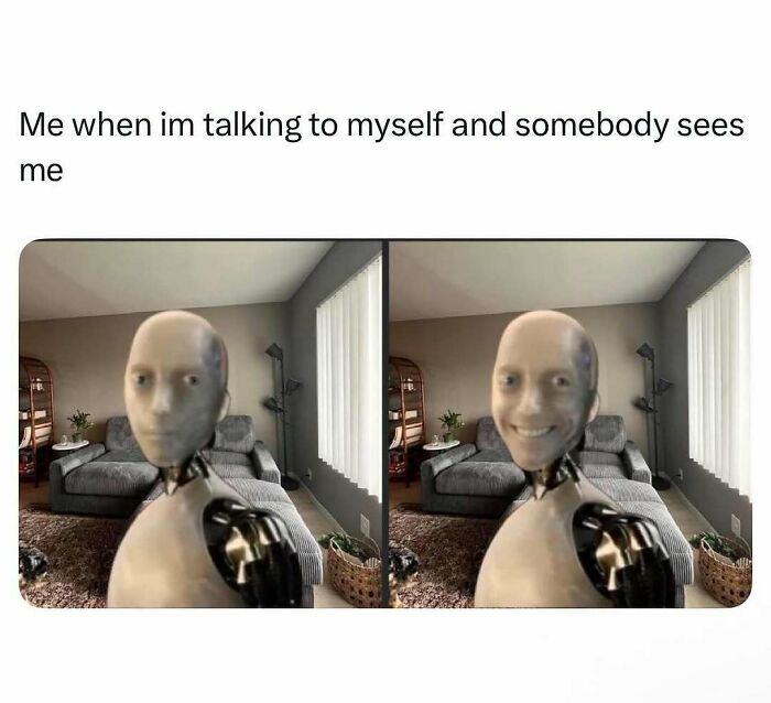 Robot with a human face showing relatable energy while feeling caught talking to itself in a living room setting.
