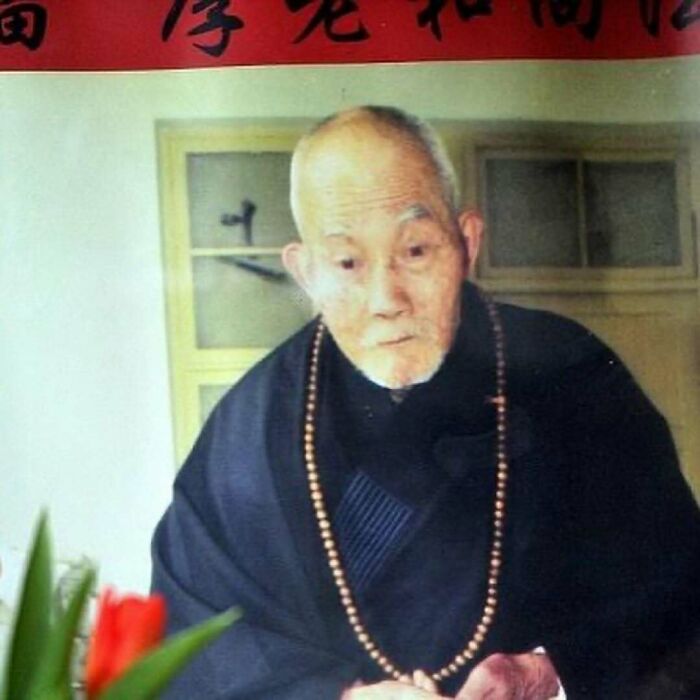 Portrait of an elderly man wearing traditional attire and prayer beads, showcasing a random fun fact about nature and animals.