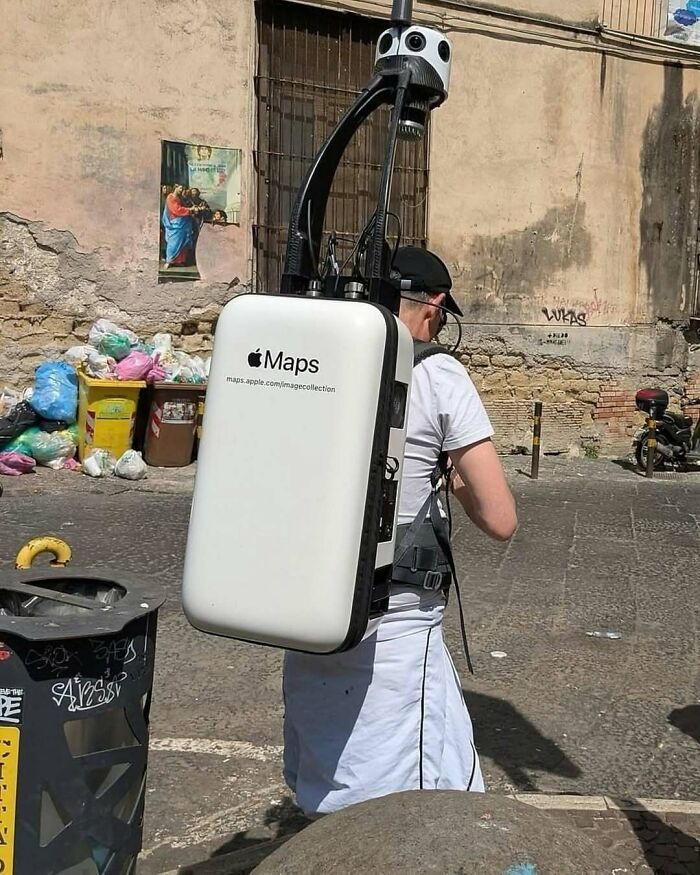 Person wearing a large Apple Maps camera rig walking outdoors, showcasing technology in nature and random fun facts.