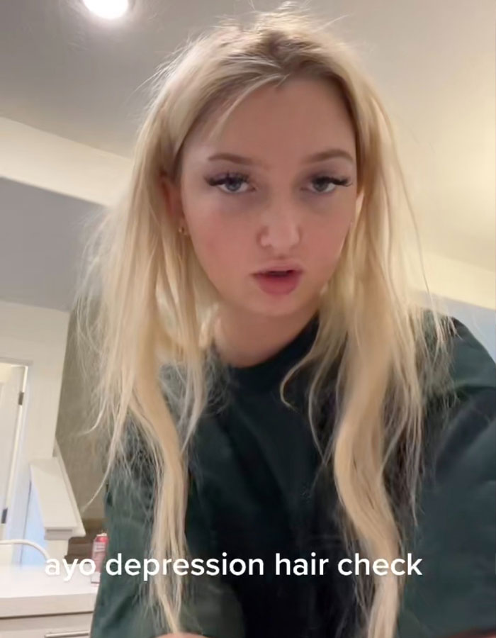 Young woman with messy blonde hair exemplifying the depression hairstyle trend, capturing Millennial and Gen Z reactions.