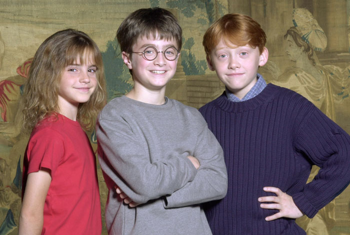 Emma Watson with Daniel Radcliffe and Rupert Grint in a Harry Potter scene discussing the resurfaced incest interview controversy.