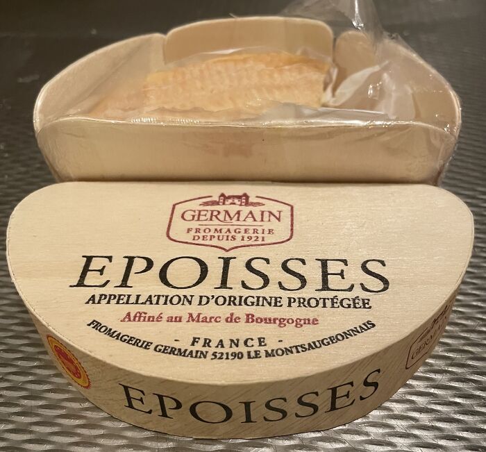 Epoisses cheese in wooden packaging, one of the surprising foods banned in the USA for safety reasons.