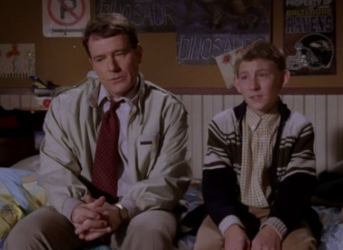 Bryan Cranston and actor in a scene from Malcolm In The Middle discussing why Dewey won’t return in the comeback. Bryan Cranston and actor in a scene from Malcolm In The Middle discussing why Dewey won’t return in the comeback.