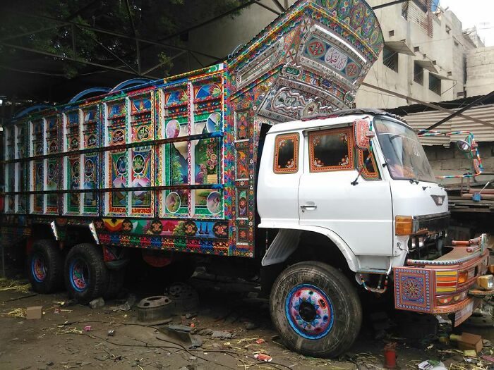 Colorful truck transformed into a stunning work of art with intricate patterns by a talented artist.