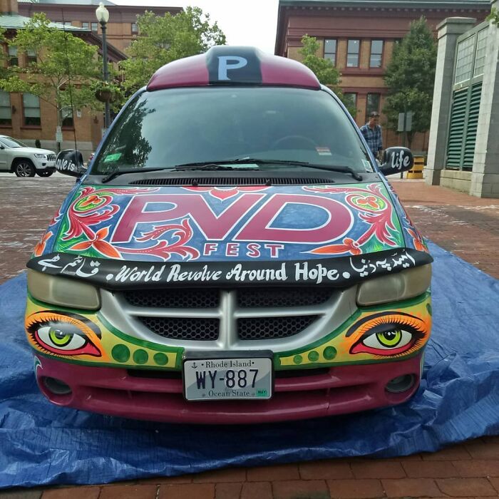 Colorful car art featuring intricate patterns and vibrant designs on the hood and front, showcasing stunning works of art.