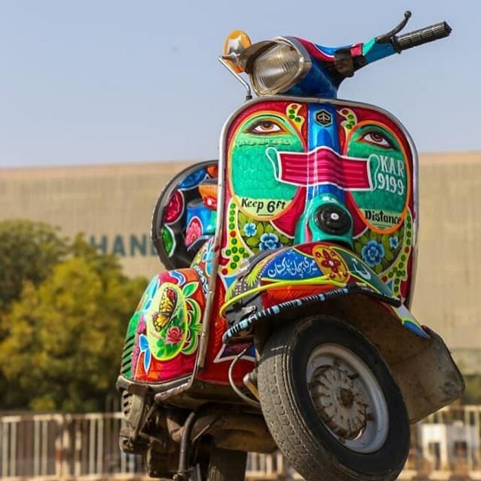 Colorful scooter decorated with intricate patterns and vibrant designs as stunning works of art by an artist.