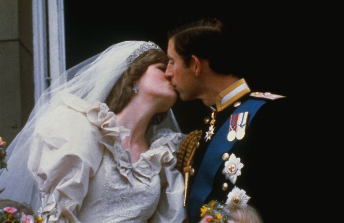Princess Diana kissing Prince Charles on their wedding day, highlighting fascinating facts about Princess Diana and royalty.