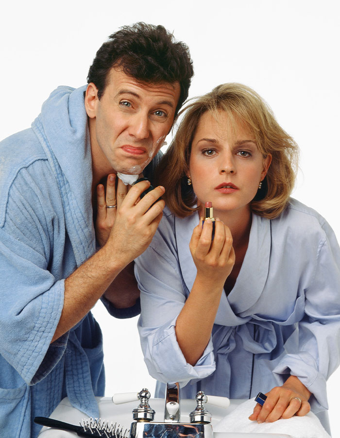 Helen Hunt in a bathrobe applying lipstick, embracing natural beauty and defying beauty standards without diets or surgery. Helen Hunt in a bathrobe applying lipstick, embracing natural beauty and defying beauty standards without diets or surgery.
