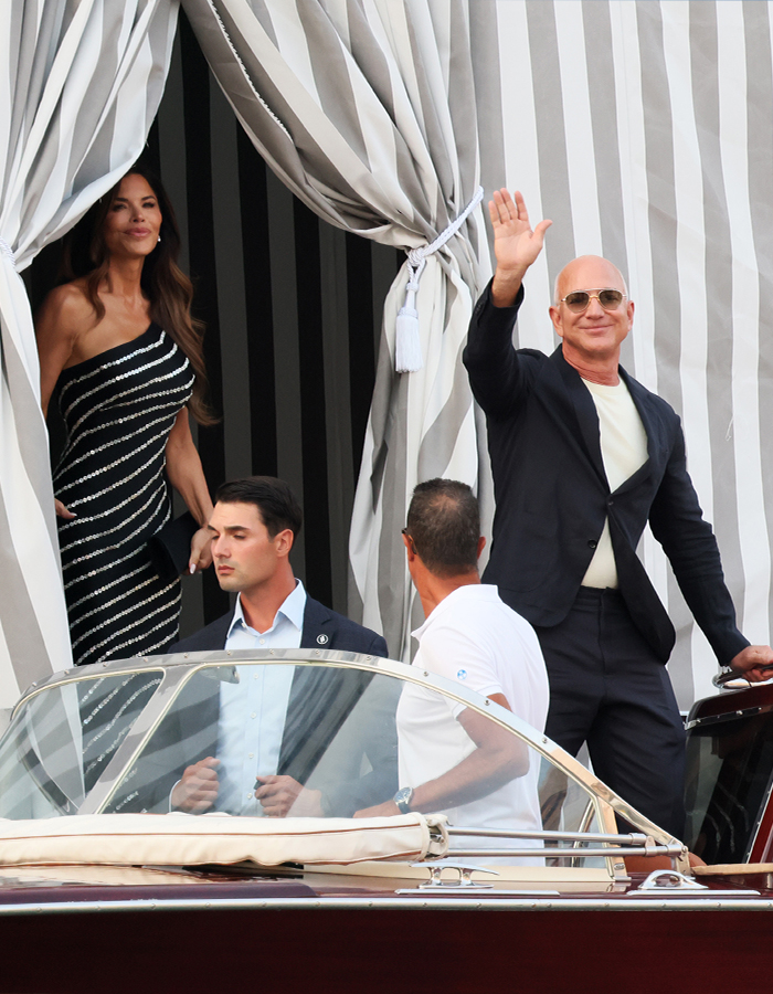 Jeff Bezos waving from a boat near a striped wedding location, possibly revealed by Ivanka Trump photo. Jeff Bezos waving from a boat near a striped wedding location, possibly revealed by Ivanka Trump photo.