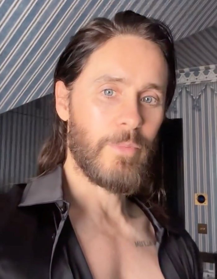 Jared Leto with beard and long hair in a striped room, related to inappropriate underage claims expos&eacute;.