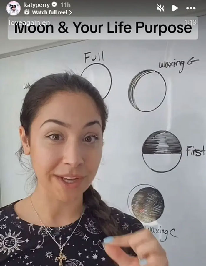 Woman explaining moon phases on whiteboard with drawings, relating to Katy Perry posts telling message after breakup.