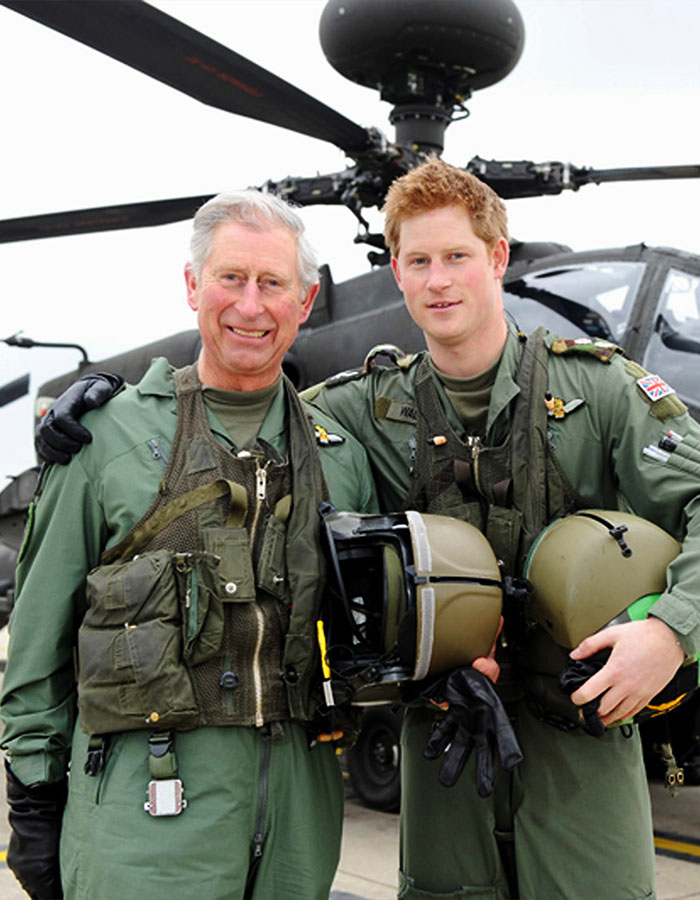 King Charles and Prince Harry in military flight suits posing together in front of a helicopter for Father&rsquo;s Day message.