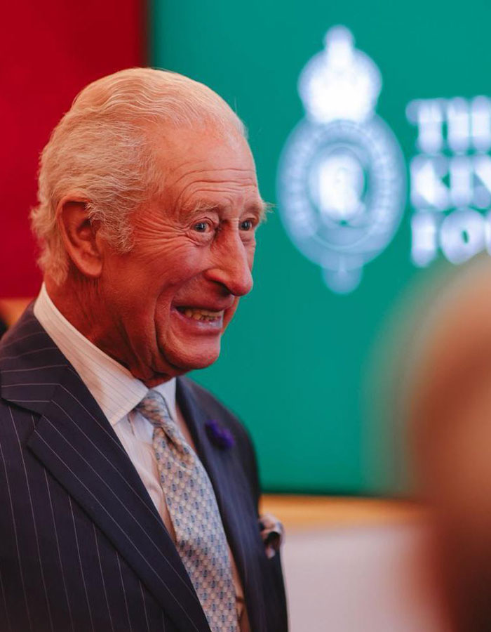 King Charles smiling warmly at an event, sharing a heartfelt Father&rsquo;s Day message amid calls for reconciliation.