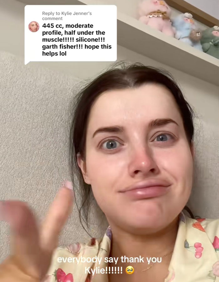 Woman sharing details about breast augmentation surgery with overlay text including implant size and type in a casual setting.