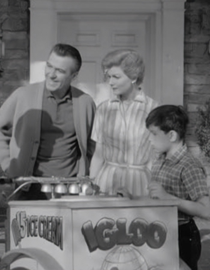 Black and white photo of a 1950s show cast by an ice cream cart, related to beloved 50s show cast reunion. Black and white photo of a 1950s show cast by an ice cream cart, related to beloved 50s show cast reunion.