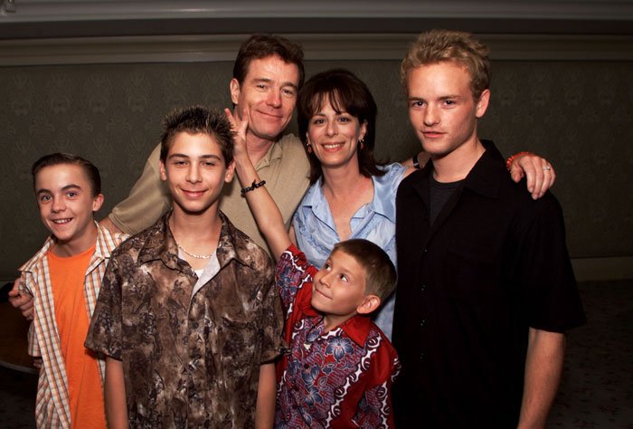 Cast of Malcolm in the Middle featuring Bryan Cranston posing with co-stars in a group photo from the show’s early years Cast of Malcolm in the Middle featuring Bryan Cranston posing with co-stars in a group photo from the show’s early years