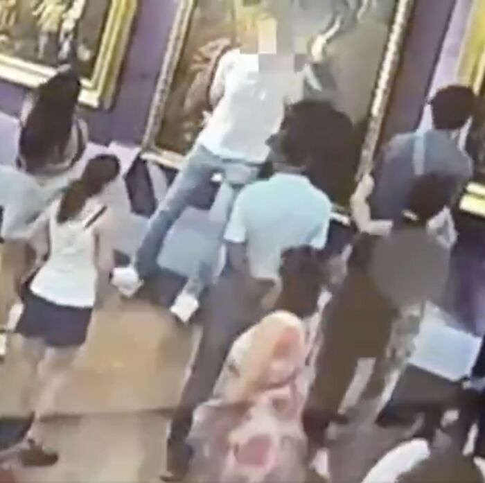 Tourist causing damage to 18th century painting in Italy museum while taking a selfie, sparking public outrage.