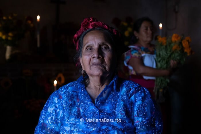 Elderly woman in traditional attire captured by photographer revealing unseen realities of our world.