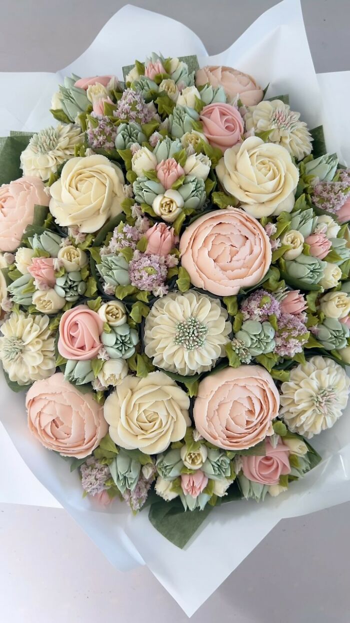 Bouquet of baked goods designed as realistic flower arrangements with pastel colors and detailed petals.