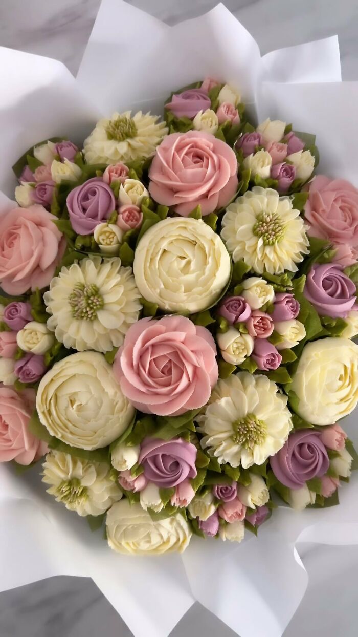 Bouquet of pink, purple, and white baked goods designed to look like flower bouquets by an artist.