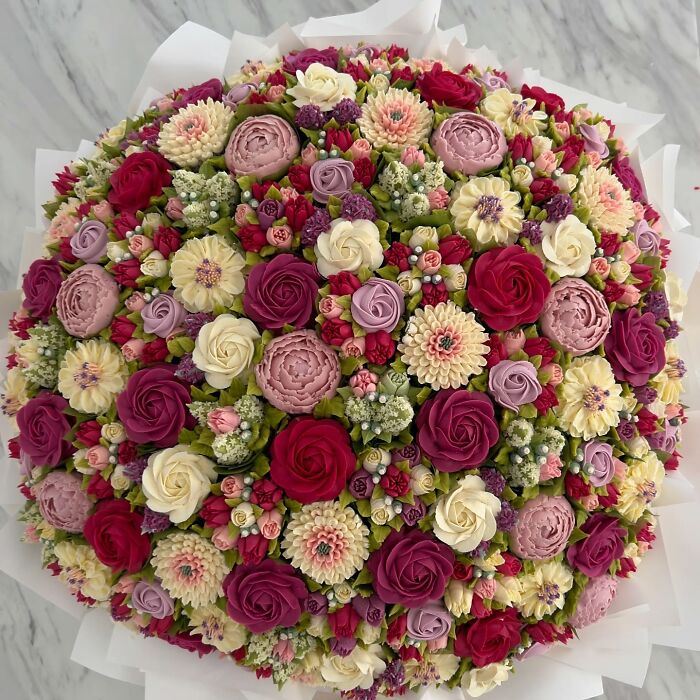 A vibrant bouquet of baked goods exquisitely designed to look like a variety of colorful flowers by the artist.