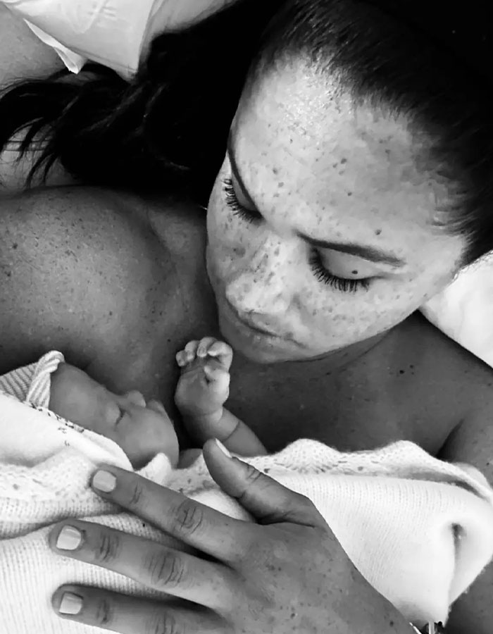 Meghan Markle holding her newborn baby close, showcasing a tender moment related to viral pregnancy twerk video. Meghan Markle holding her newborn baby close, showcasing a tender moment related to viral pregnancy twerk video.