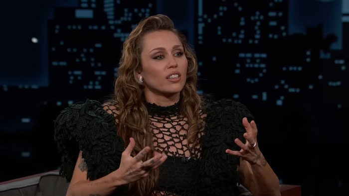 Miley Cyrus discussing her brutal infection and doctors speculating about the possible root cause during a TV interview.