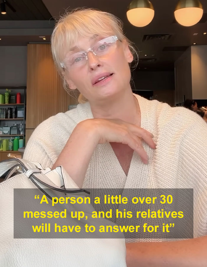 Blonde woman in glasses and beige sweater sharing story related to model found with broken bones in Dubai case.