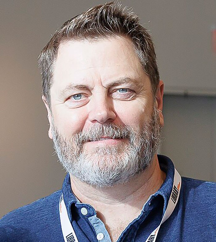 Nick Offerman with beard and blue shirt attending event, known for slamming Michael Flynn's son over anti-Pride post. Nick Offerman with beard and blue shirt attending event, known for slamming Michael Flynn's son over anti-Pride post.