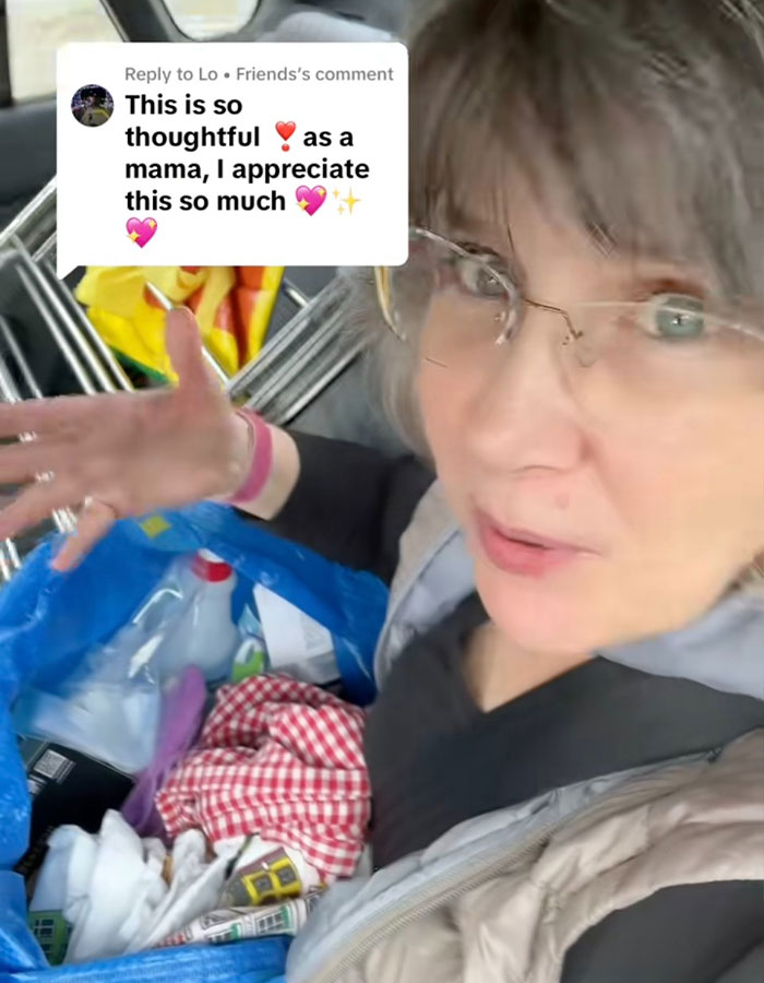 Woman showing an unusual birthday gift in a blue bag, sparking backlash over the mom&rsquo;s insulting present and reactions online.