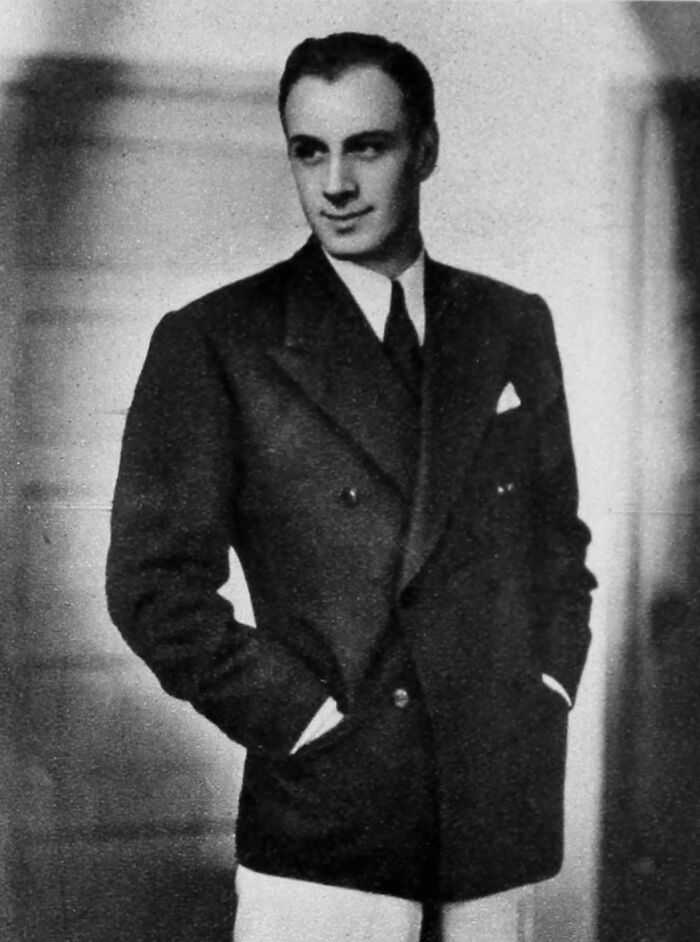 Black and white photo of a 20th century star wearing a suit, representing stars we lost too soon and biggest shocks.