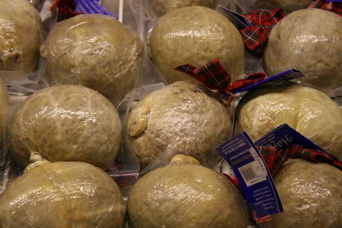 Packaged haggis, one of the surprising foods banned in the USA, displayed with festive ribbons and labels.