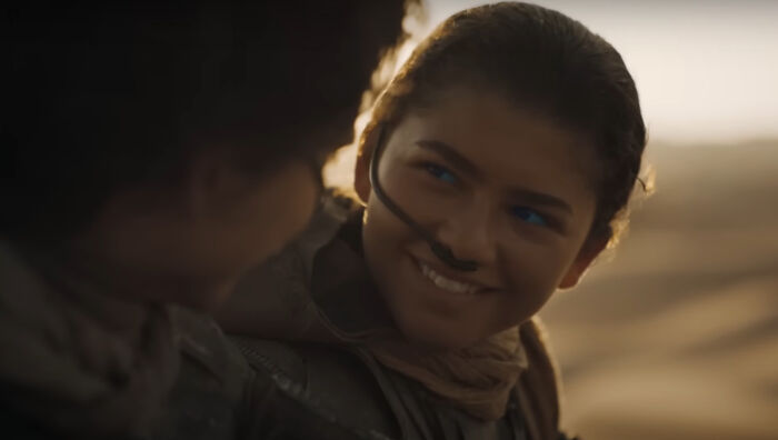 Close-up of two characters sharing a smile in a cinematic scene from one of the new millennium's greatest films.