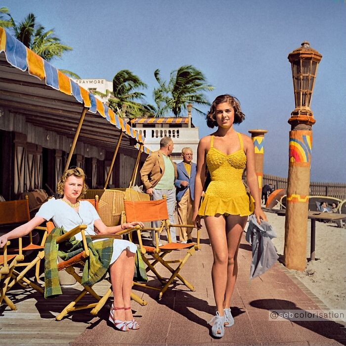 Colorized historical photo of women at a beach club showcasing vibrant vintage fashion and summer style.