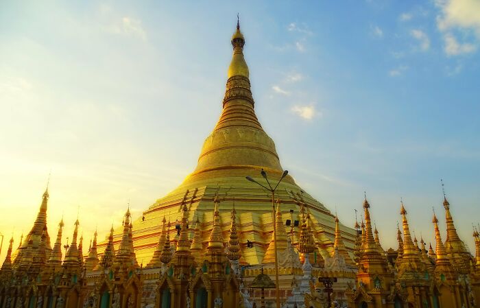 Golden pagoda at sunset, showcasing intricate architecture and historical design, related to da Vinci wedding planner facts.