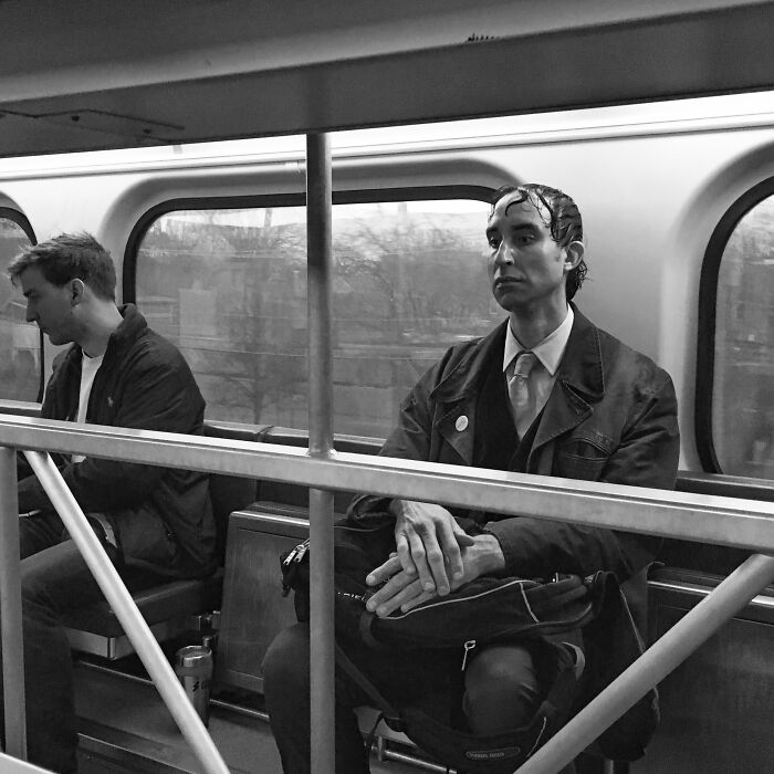 Two men sitting on a Chicago subway captured in an intimate street photo showing the city’s daily life and soul.