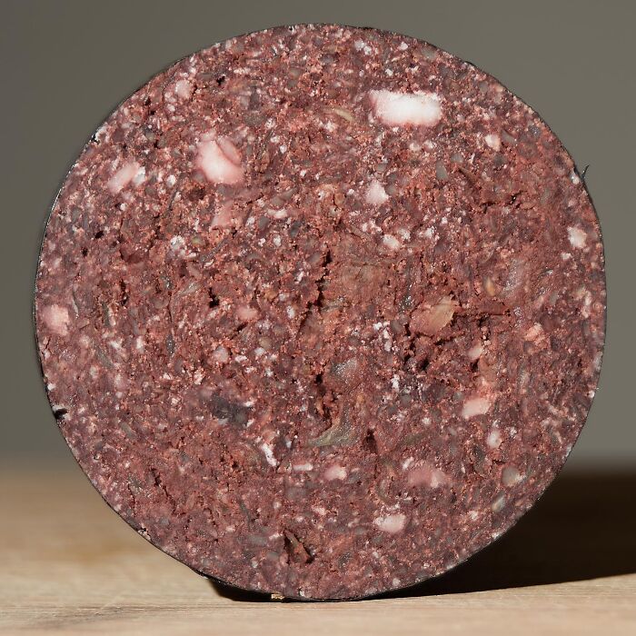 Close-up of a round blood sausage slice, one of the surprising foods banned in the USA.