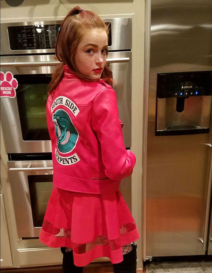 Teen girl wearing South Side Serpents jacket warns parents about dusting challenge dangers.