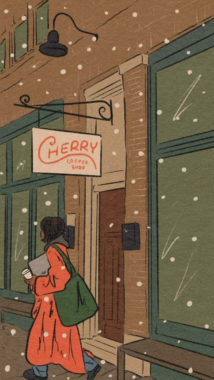 Cozy illustration by Tatyana Alanis of a woman in a red coat walking past a coffee shop in falling snow.