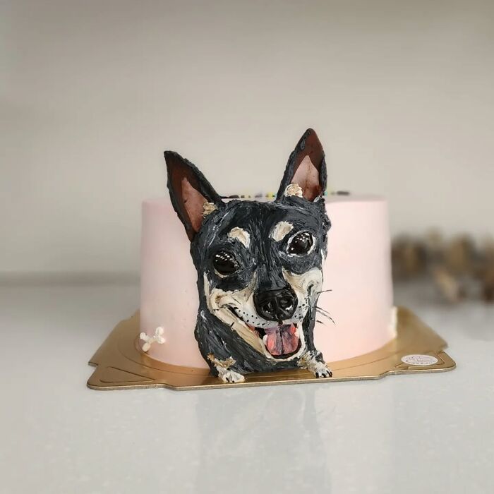 Pet-themed cake featuring a 3D dog design with detailed frosting capturing the unique personality of the pet.