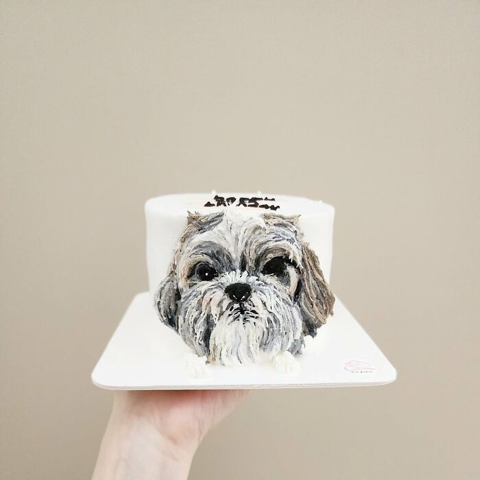 Pet-themed cake designed to capture the unique personality of an adorable dog with realistic fur details.