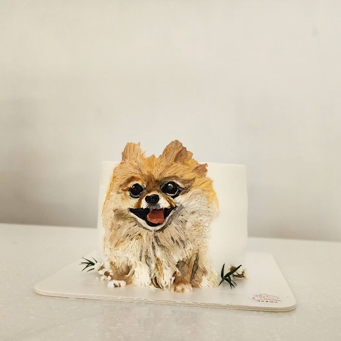 Pet-themed cake featuring a detailed and adorable dog design capturing the unique personality through realistic cake art.