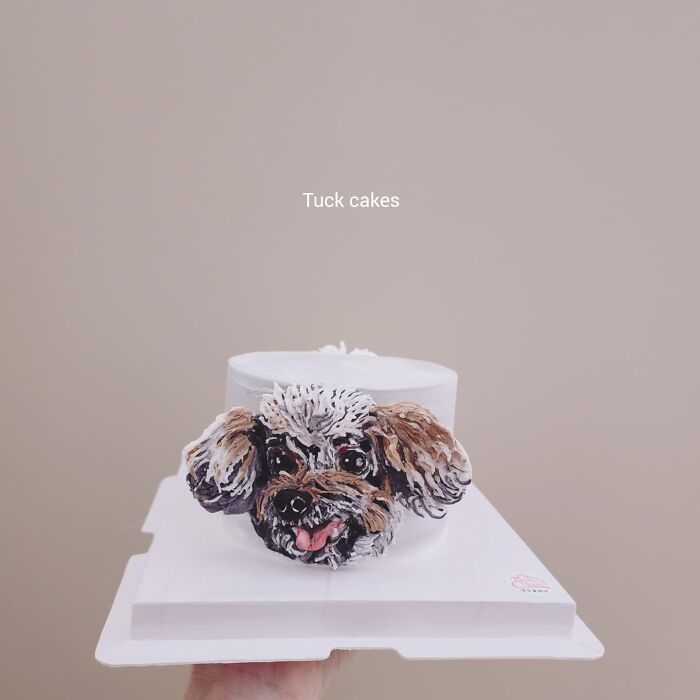 Pet-themed cake featuring a detailed and adorable dog face, showcasing unique personality in edible art.