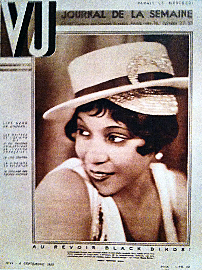 Vintage Harlem Renaissance era magazine cover featuring a stylish African American woman in a hat and dress.