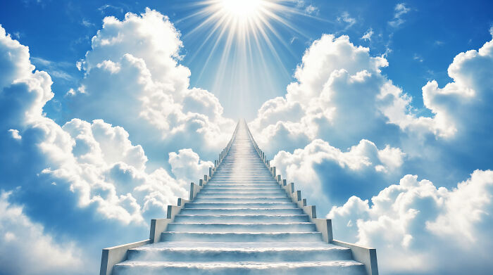 Stairway to bright sunlight surrounded by clouds, symbolizing inspiration and dreamy baby names ideas.