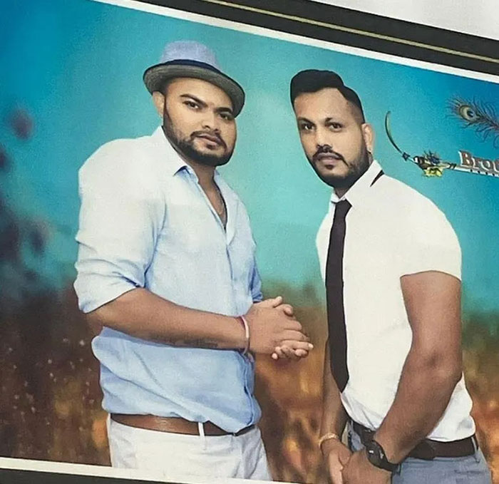 Two men posing together, representing Air India survivor and his brother, highlighting survivor's guilt story.